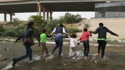 CIUDAD JUAREZ, MEXICO - MAY 20:  Migrants cross the border between the U.S. and Mexico at the Rio Grande river, as they enter El Paso, Texas, on May 20, 2019 as taken from Ciudad Juarez, Mexico. The location is in an area where migrants frequently turn themselves in and ask for asylum in the U.S. after crossing the border.  Approximately 1,000 migrants per day are being released by authorities in the El Paso sector of the U.S.-Mexico border amidst a surge in asylum seekers arriving at the Southern border. (Photo by Mario Tama/Getty Images)