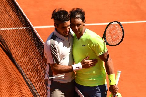 Rafael Nadal (right) exchanges a hug with Roger Federer after they played in the French Open semifinals. Who won? Nadal, to improve to 6-0 against the Swiss at Roland Garros. 
