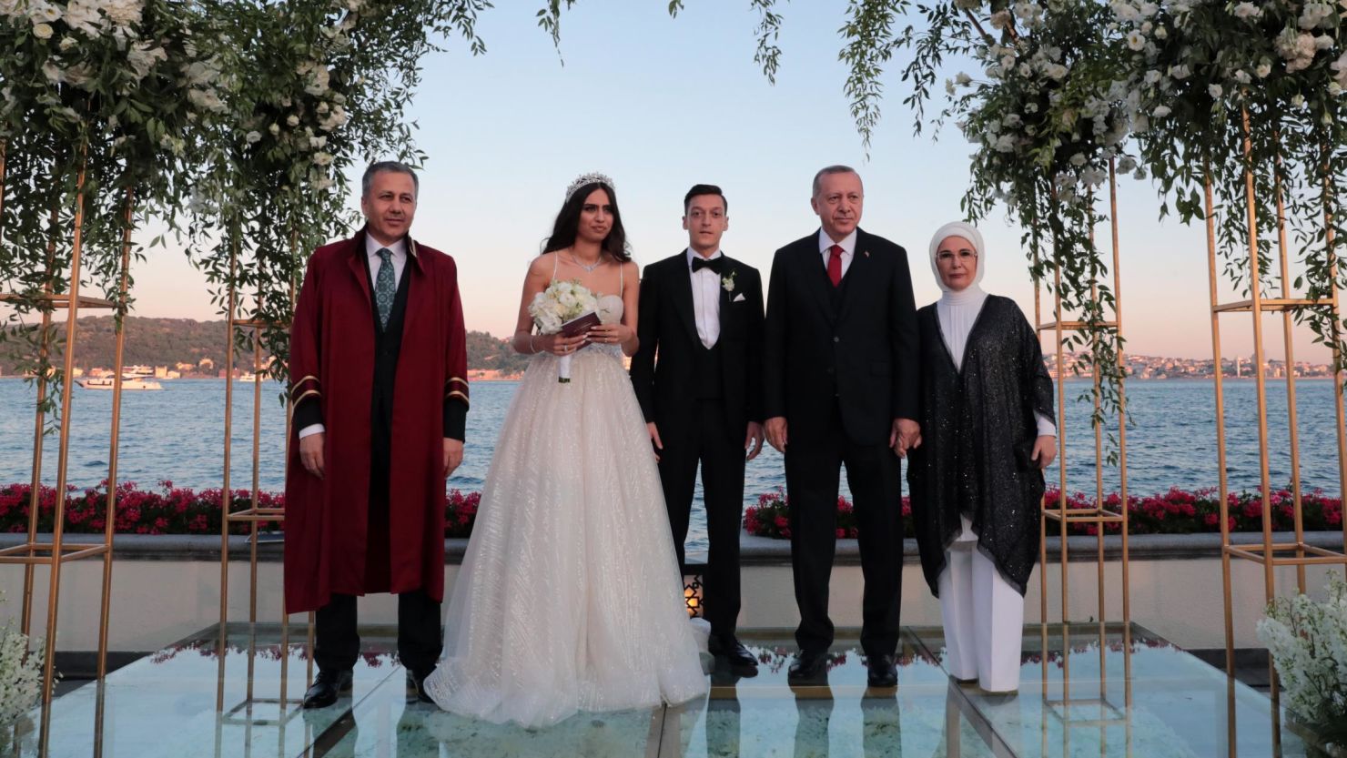 Turkish President Recep Tayyip Erdogan, second from right, and his wife Emine Erdogan attend the wedding ceremony Friday of footballer Mesut Ozil and Amine Gulse, along with the governor of Istanbul Ali Yerlikaya, far left. 