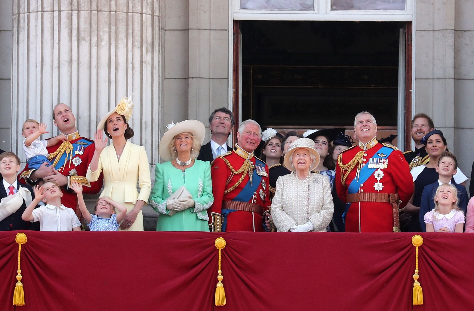 Britain's royals watch as airplanes fly overhead during Trooping the Colour.