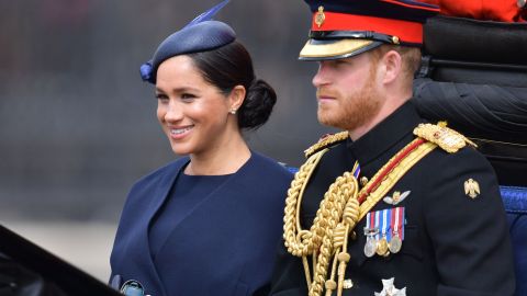Meghan and Prince Harry make their way in a horse-drawn carriage to Horseguard's Parade ahead of Trooping the Colour.