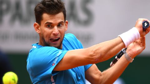 Dominic Thiem hits a backhand during his French Open semifinal Saturday against Novak Djokovic. 
