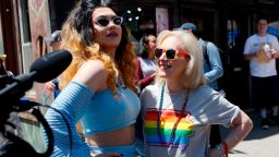 Democratic presidential candidate Kirsten Gillibrand talks with drag queen Vana Rosenberg, left, during the Capital City Pride fest, Saturday, June 8, 2019, in Des Moines, Iowa. (AP Photo/Charlie Neibergall)
