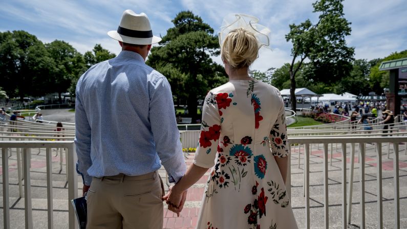 A couple overlooks the paddock at Belmont Park before the Belmont Stakes on Saturday.