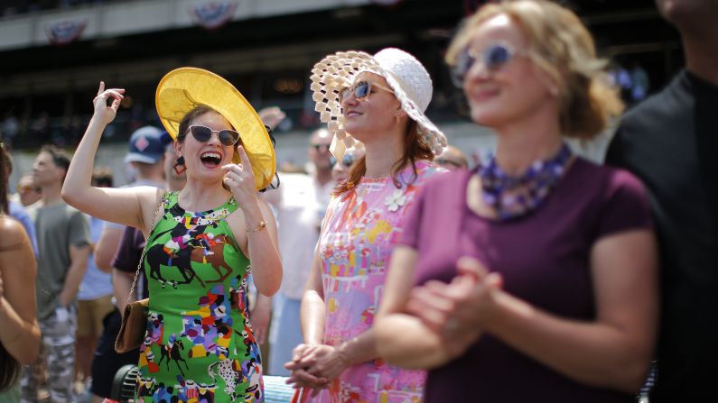 Spectators take in an afternoon race before the Belmont Stakes.