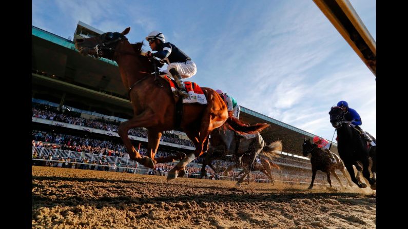 Sir Winston, ridden by jockey Joel Rosario, crosses the finish line to win the 151st running of the Belmont Stakes on Saturday, June 8, in Elmont, New York.