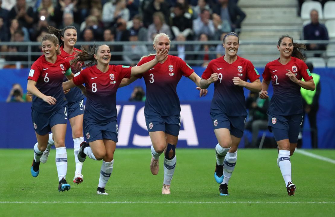 Norway players celebrate scoring a third against Nigeria.