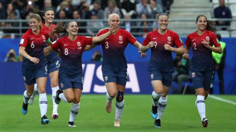 Norway players celebrate scoring a third against Nigeria.