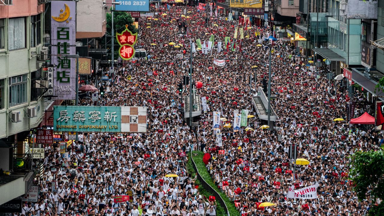 HONG KONG, HONG KONG - JUNE 09:  Protesters march on a street during a rally against the extradition law proposal on June 9, 2019 in Hong Kong China. Hundreds of thousands of protesters marched in Hong Kong in Sunday against a controversial extradition bill that would allow suspected criminals to be sent to mainland China for trial.(Photo by Anthony Kwan/Getty Images)