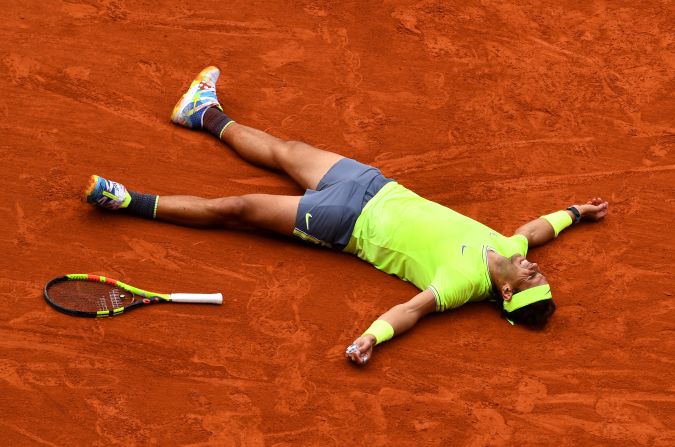 Rafael Nadal of Spain celebrates match point following the men's singles final against Dominic Thiem of Austria during day of 15  of the 2019 French Open at Roland Garros on June 9, 2019 in Paris.