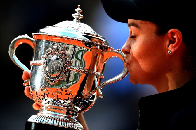 Ashleigh Barty of Australia kisses the trophy as she celebrates victory following the ladies singles final against Marketa Vondrousova of The Czech Republic during day 14 of the 2019 French Open at Roland Garros on June 8, 2019 in Paris.