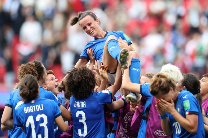 Italy team members lift Barbara Bonansea in the air as they celebrate her winning goal after the final whistle during the 2019 FIFA Women's World Cup France group C match between Australia and Italy at Stade du Hainaut on June 9, 2019 in Valenciennes, France.