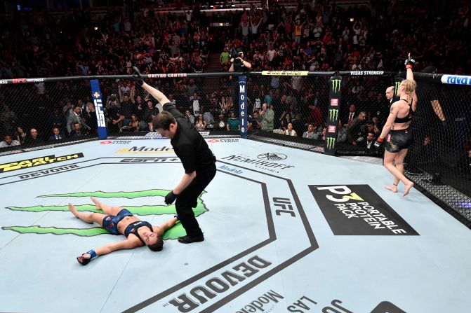 Valentina Shevchenko of Kyrgyzstan, right, celebrates her KO victory over Jessica Eye, left, in their women's flyweight championship bout during the UFC 238 event at the United Center on June 8, 2019 in Chicago, Illinois. 