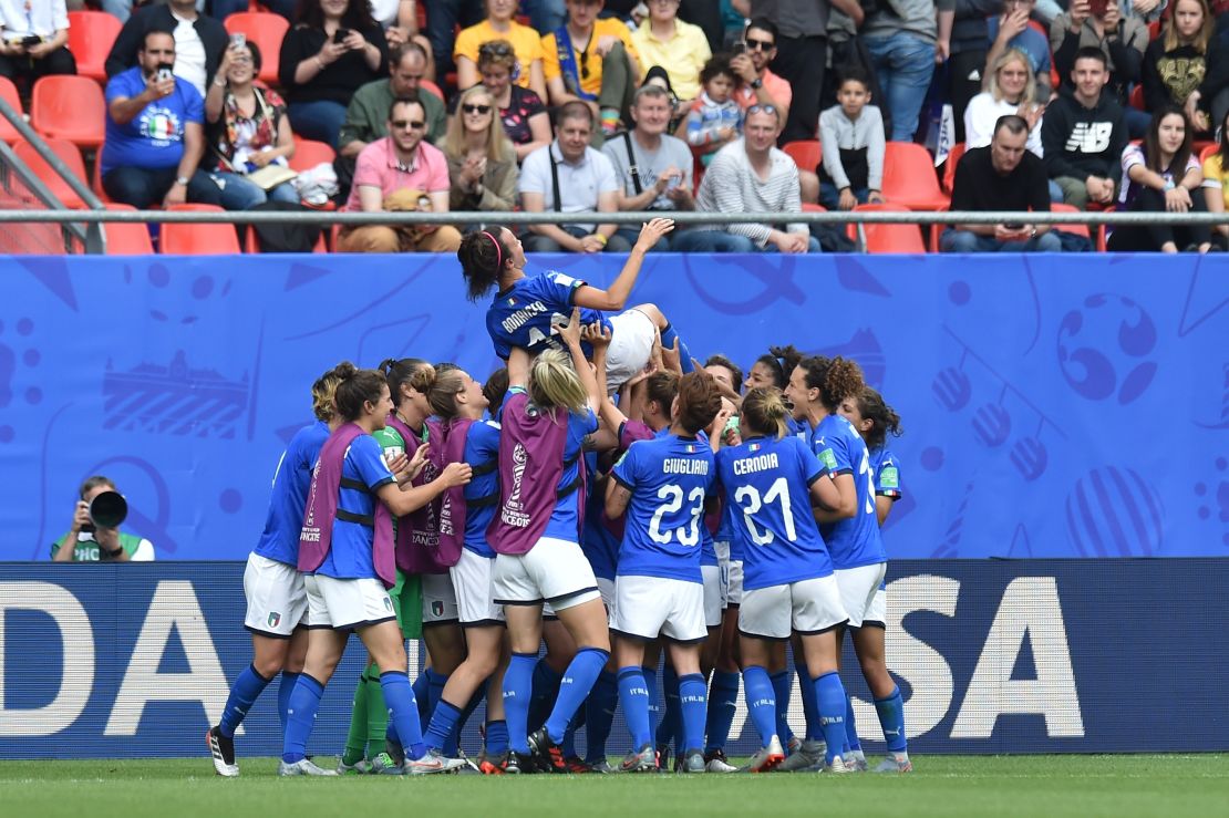 Players of Italy throw Bonansea in the air.