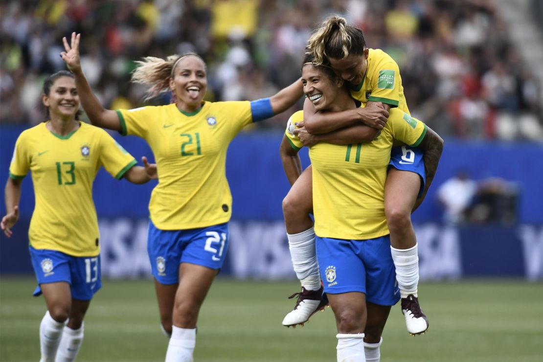 Cristiane (2ndR) is congratulated by teammates after scoring.