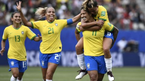 Cristiane (2ndR) is congratulated by teammates after scoring.