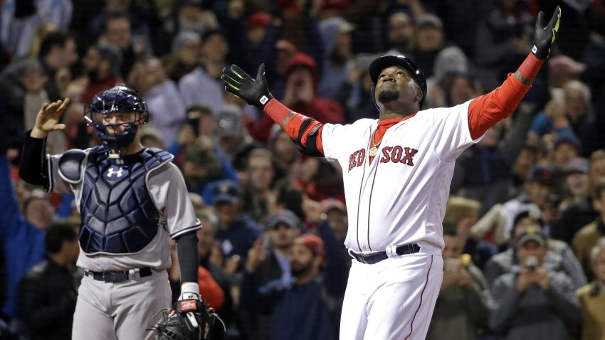 Boston Red Sox designated hitter David Ortiz celebrates his two-run home run as New York Yankees catcher Brian McCann waits during the eighth inning of a baseball game at Fenway Park on Friday, April 29, 2016, in Boston. The Red Sox won 4-2.