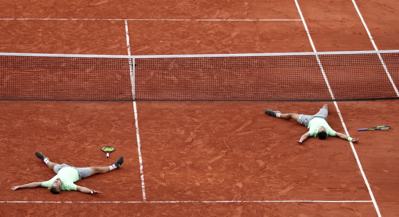 Kevin Krawietz, left, and Andreas Mies, right, of Germany react after winning the men's doubles final match during the French Open tennis tournament at Roland Garros in Paris on June 8,  2019.