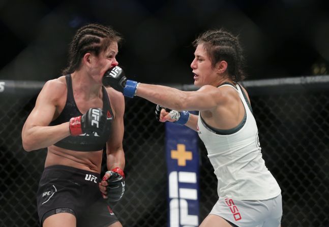 Karolina Kowalkiewicz (red gloves) and Alexa Grasso (blue gloves) during UFC 238 at United Center.