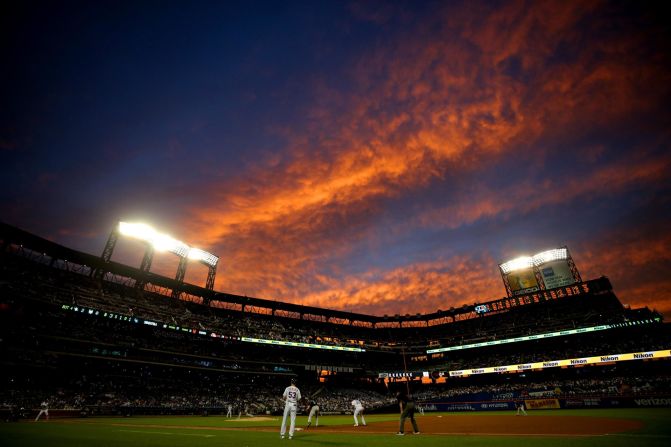 Sunset is seen over Citi Field during the fourth inning between the New York Mets and the Colorado Rockies.