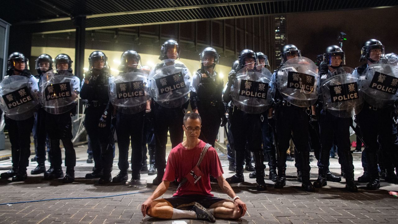 Police gather at a rally against a controversial extradition law proposal in Hong Kong on early June 10, 2019.