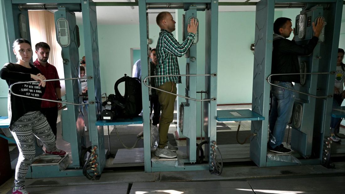 <strong>Safety checks:</strong> Visitors pass through radiation measuring devices during guided tours around Chernobyl.