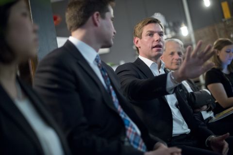 Swalwell and other members of Congress talk with young entrepreneurs at an event in New York in April 2015.