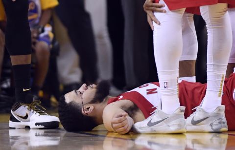Toronto guard Fred VanVleet lies on the floor after he was hit in the face by an inadvertent elbow in Game 4. One of his teeth was also knocked out.