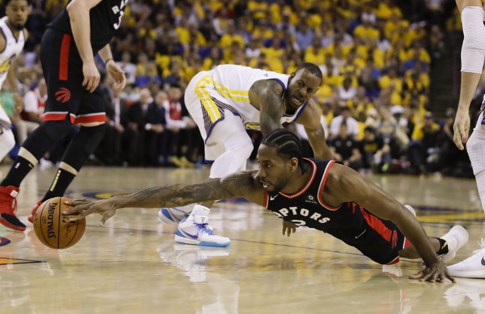 Leonard reaches for a loose ball during the first half of Game 3. He finished the game with 30 points, seven rebounds and six assists.