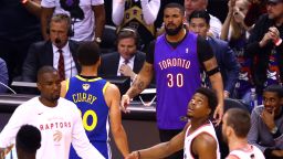 TORONTO, ONTARIO - MAY 30:  Rapper Drake and Stephen Curry #30 of the Golden State Warriors exchange words during a timeout in the first quarter during Game One of the 2019 NBA Finals between the Golden State Warriors and the Toronto Raptors at Scotiabank Arena on May 30, 2019 in Toronto, Canada. NOTE TO USER: User expressly acknowledges and agrees that, by downloading and or using this photograph, User is consenting to the terms and conditions of the Getty Images License Agreement. (Photo by Vaughn Ridley/Getty Images)