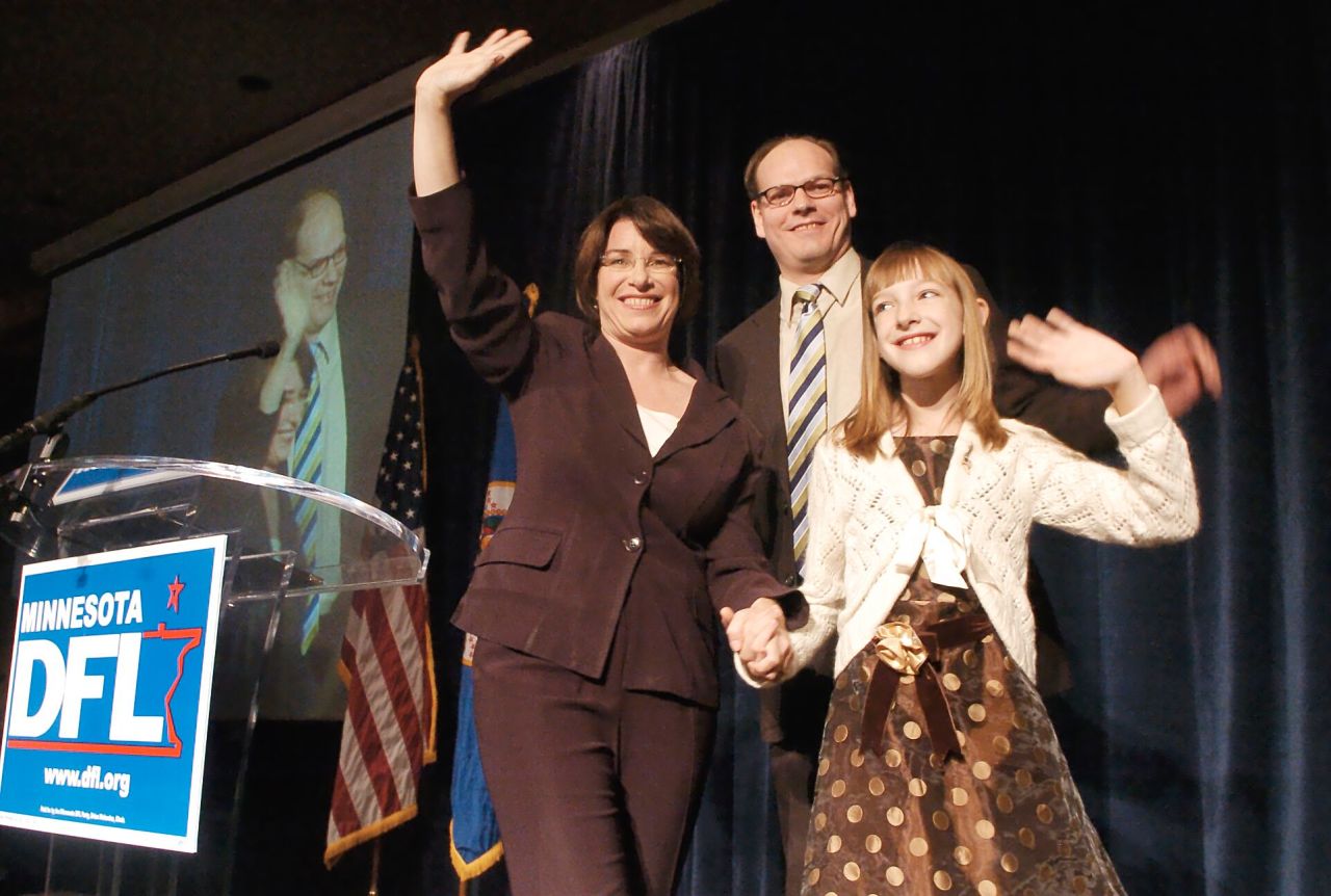 Klobuchar celebrates with her husband and daughter after she was elected to the Senate in November 2006. Klobuchar won 58% of the vote to become the state's first-ever female senator.