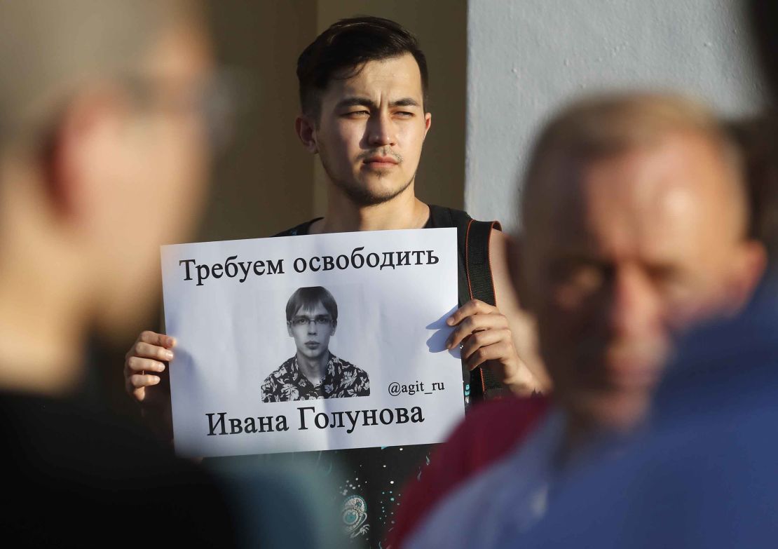 A protester in St. Petersburg holds up a poster calling for Golunov to be freed on Saturday.  