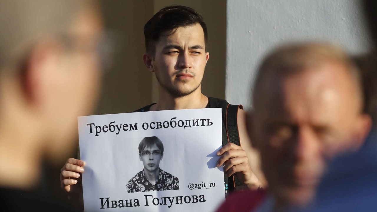 A protester in St. Petersburg holds up a poster calling for Golunov to be freed on Saturday.  
