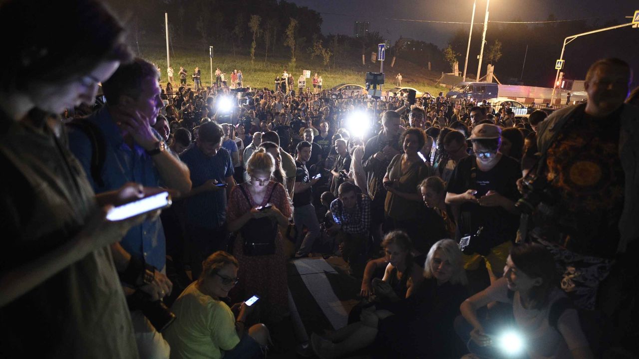 Colleagues and supporters of Golunov gather at a court building in Moscow on Saturday.