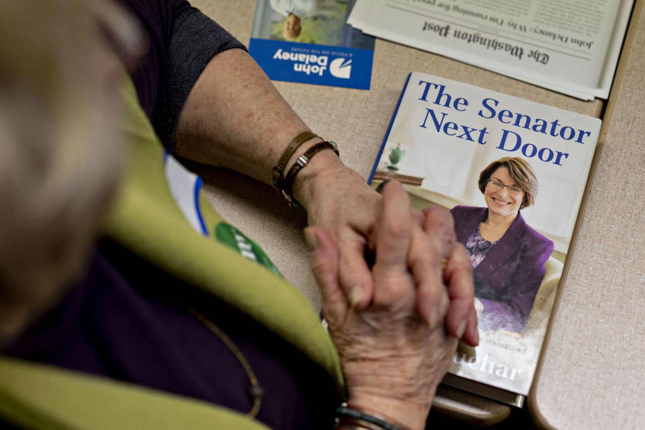A person sits with Klobuchar's memoir during a Klobuchar campaign stop in Albia, Iowa, in February 2019.