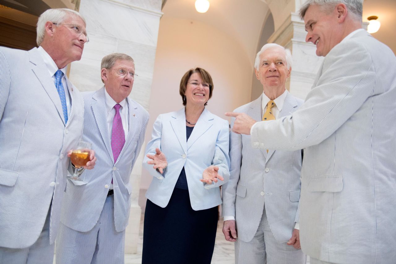 Klobuchar and several of her Senate colleagues attend a photo shoot for National Seersucker Day in June 2016.