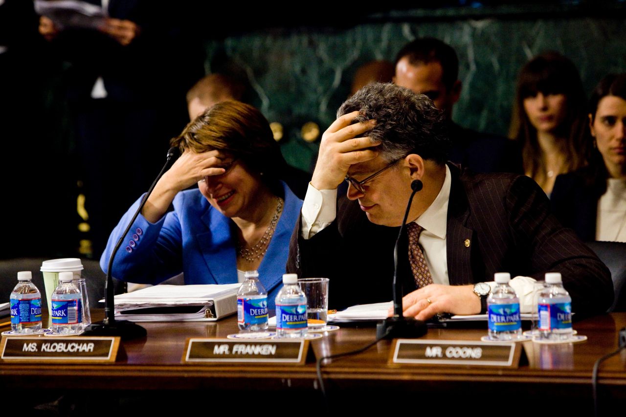 In March 2013, Klobuchar and US Sen. Al Franken attend a Senate hearing about a measure that would reinstate a ban on assault weapons.