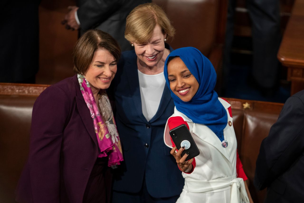 Klobuchar, left, takes a photo with US Sen. Tammy Baldwin, center, and US Rep. Ilhan Omar before the State of the Union address in February 2019.