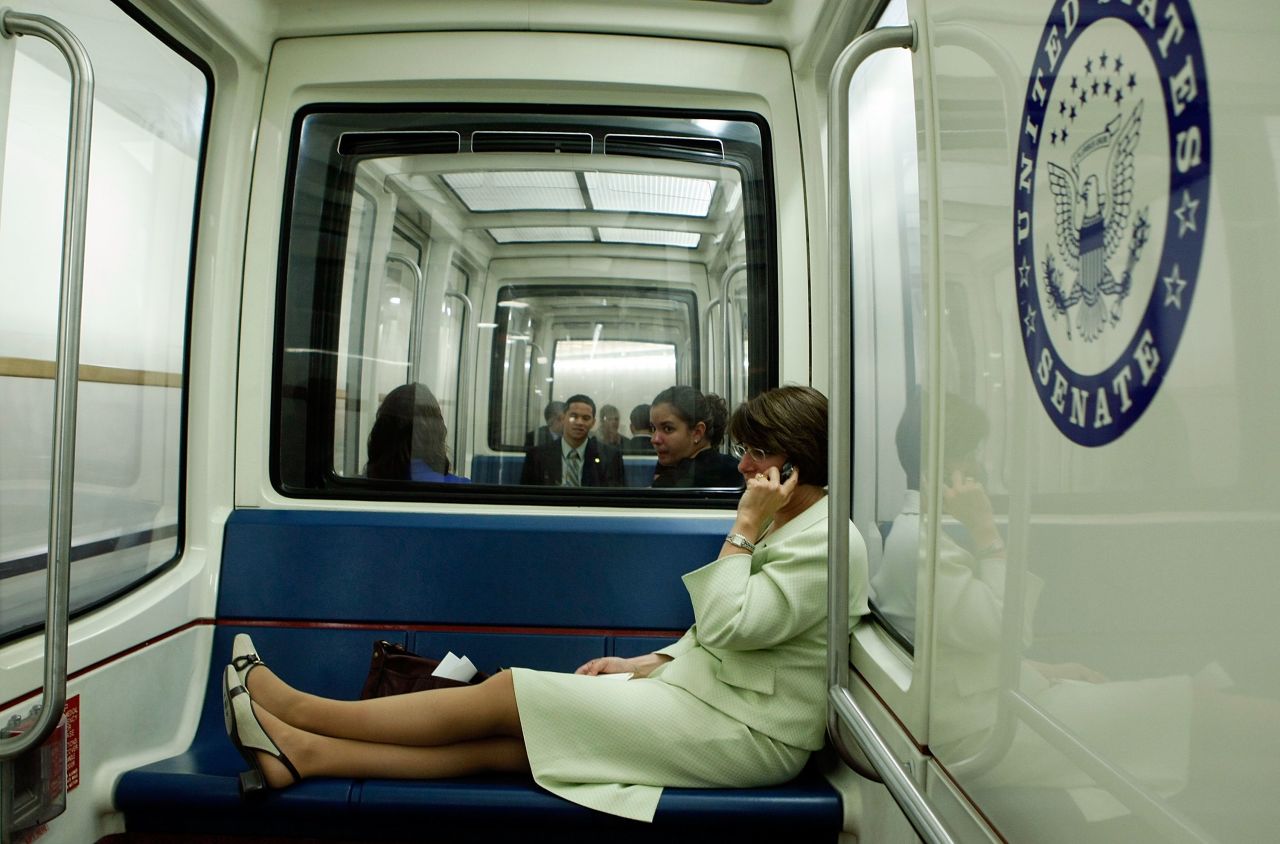 Klobuchar talks on her cell phone as she rides the Capitol subway in July 2008.