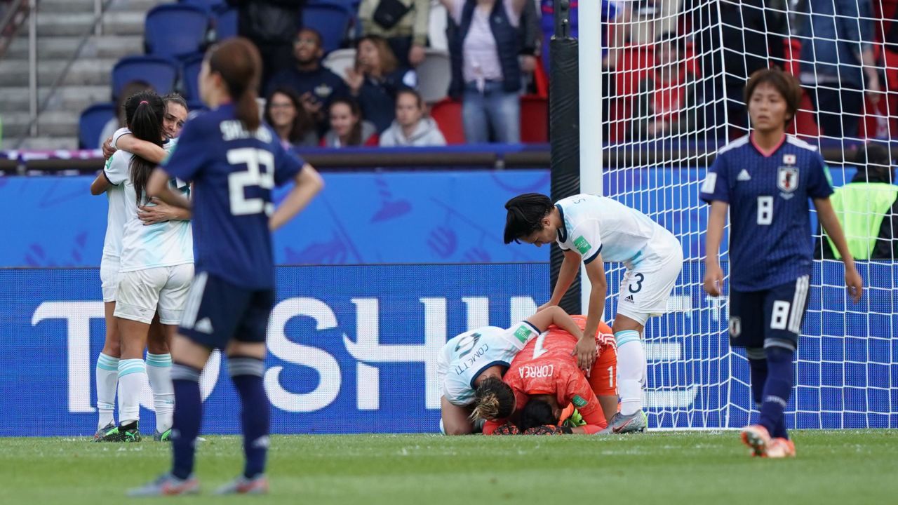 Argentina's players celebrate securing their first ever point in Women's World Cup history