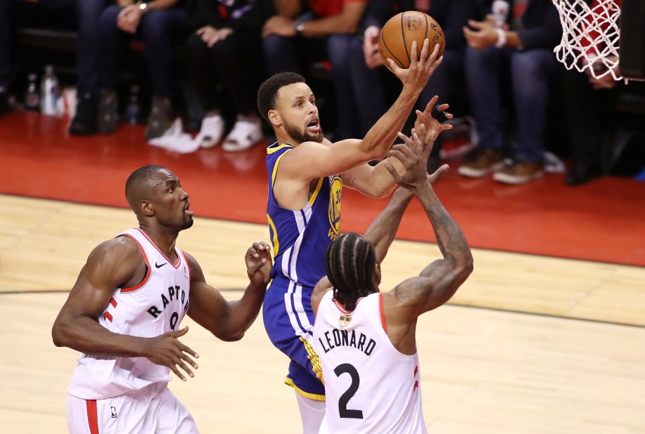 Curry rises for a shot during Game 5 on Monday, June 10. Curry had 31 points for the Warriors, who staved off elimination with a 106-105 win in Toronto.