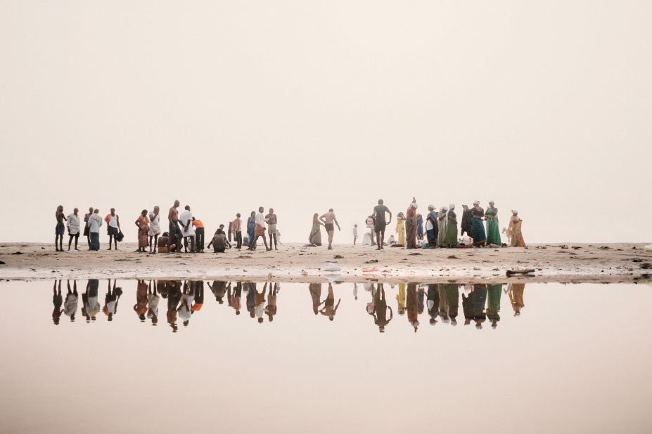 People prepare to bathe in one of India's holiest rivers, the Ganges. Scroll through to see more images from photographer Giulio Di Sturco's book "Ganga Ma."