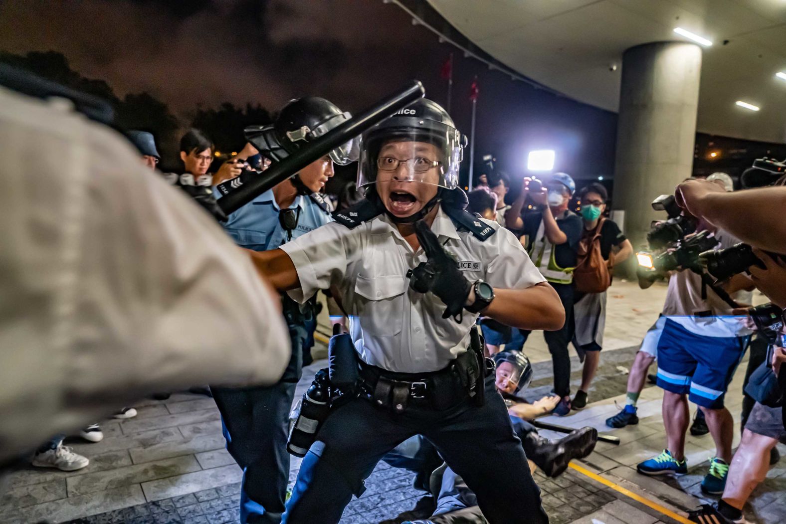 Police officers charge toward protesters during clashes on Monday, June 10. It was a continuation of protests that started the day before.