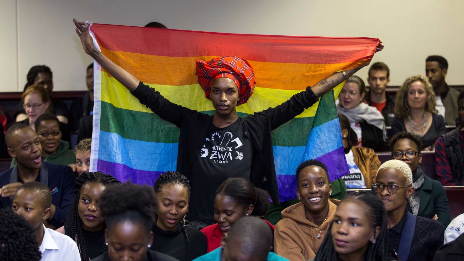 Activist Kat Kai Kol-Kes holds a LGBTQ pride flag inside Botswana's High Court on Tuesday, where lawmakers  overturned a law that criminalized same-sex relations.
