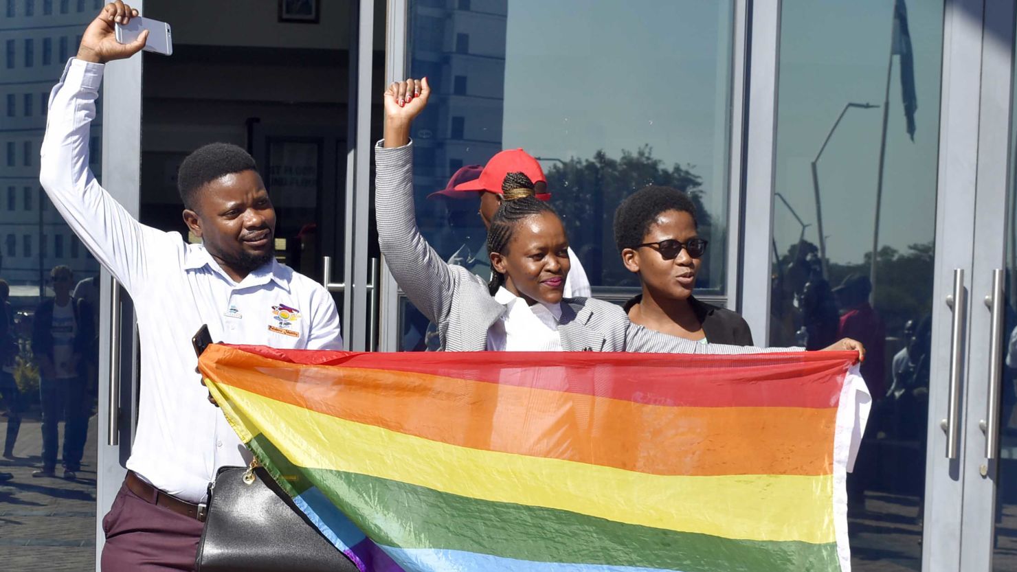Activists celebrate outside the High Court in Gaborone, Botswana, Tuesday June 11, 2019. Botswana became the latest country to decriminalize gay sex. 