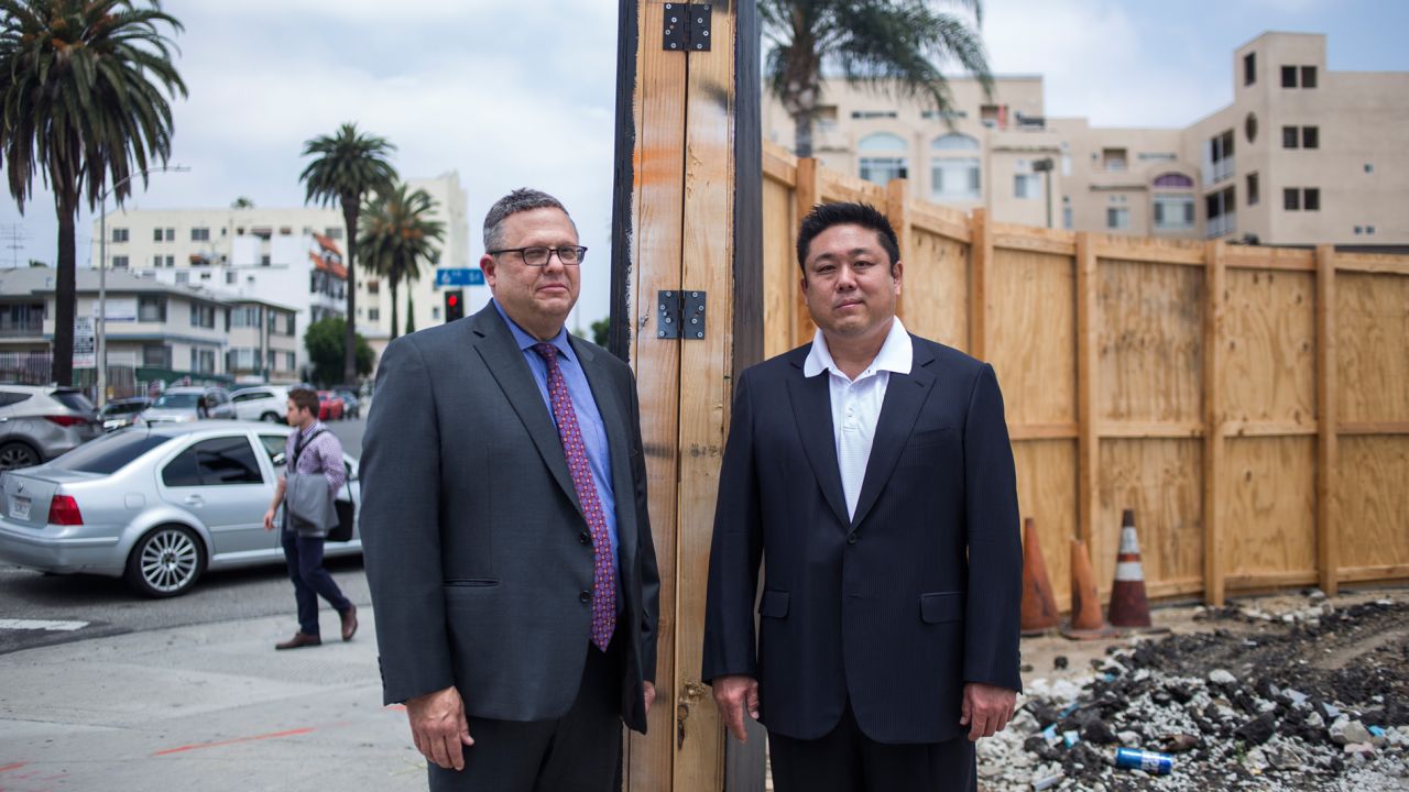 Bryan Shaffer, left, and Leo Y. Lee at the site of a new luxury hotel in Los Angeles' Koreatown. Shaffer is helping Lee, the developer, line up financing for the project. They are seeking Opportunity Fund investment for part of the cost.