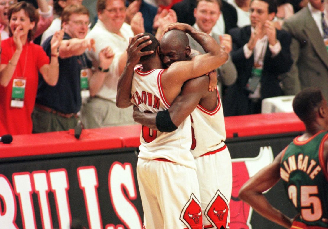 Michael Jordan and Randy Brown hug during the closing seconds of Game 6 of the NBA Finals in 1996.