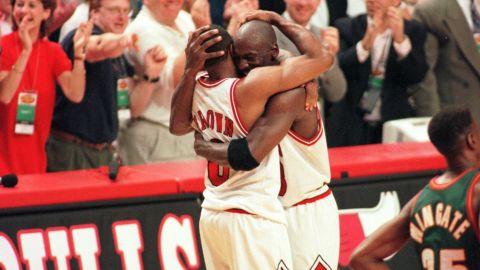 Michael Jordan and Randy Brown hug during the closing seconds of Game 6 of the NBA Finals in 1996.