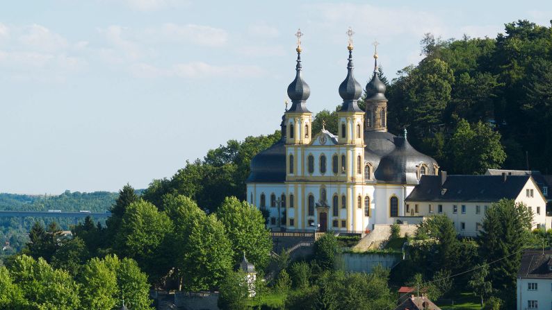 <strong>Käppele:</strong> The Pilgrimage Church of the Visitation of Mary is known for ornate architecture built by Balthasar Neumann between 1748 and 1750. Just as stunning as the Käppele's onion domes and indoor frescoes is its location on the slope of the emerald green Nikolausberg hill.