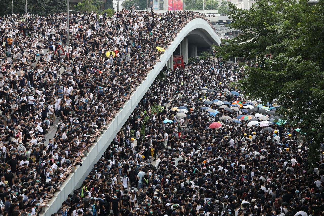 By the morning of June 12, tens of thousands of mainly young people had arrived in the area, blocking streets and bringing central Hong Kong to a standstill.